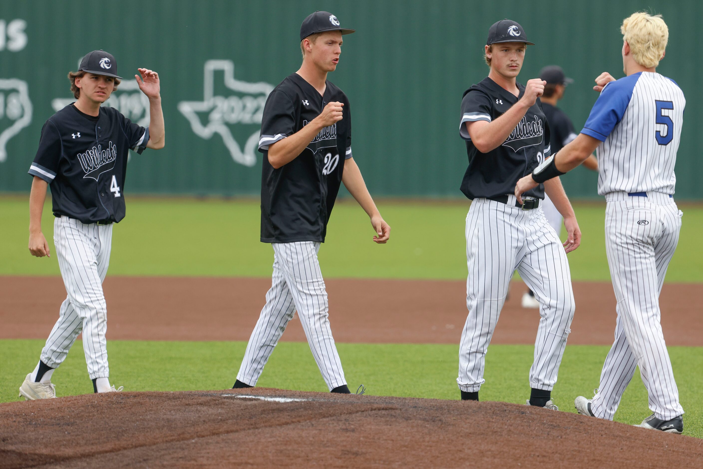 Denton Guyer players shakes hand after winning a baseball game against Byron Nelson High...