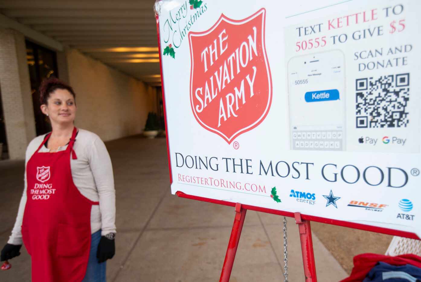 Casey Odu Onikosi rings the Salvation Army bell at NorthPark Center in Dallas.