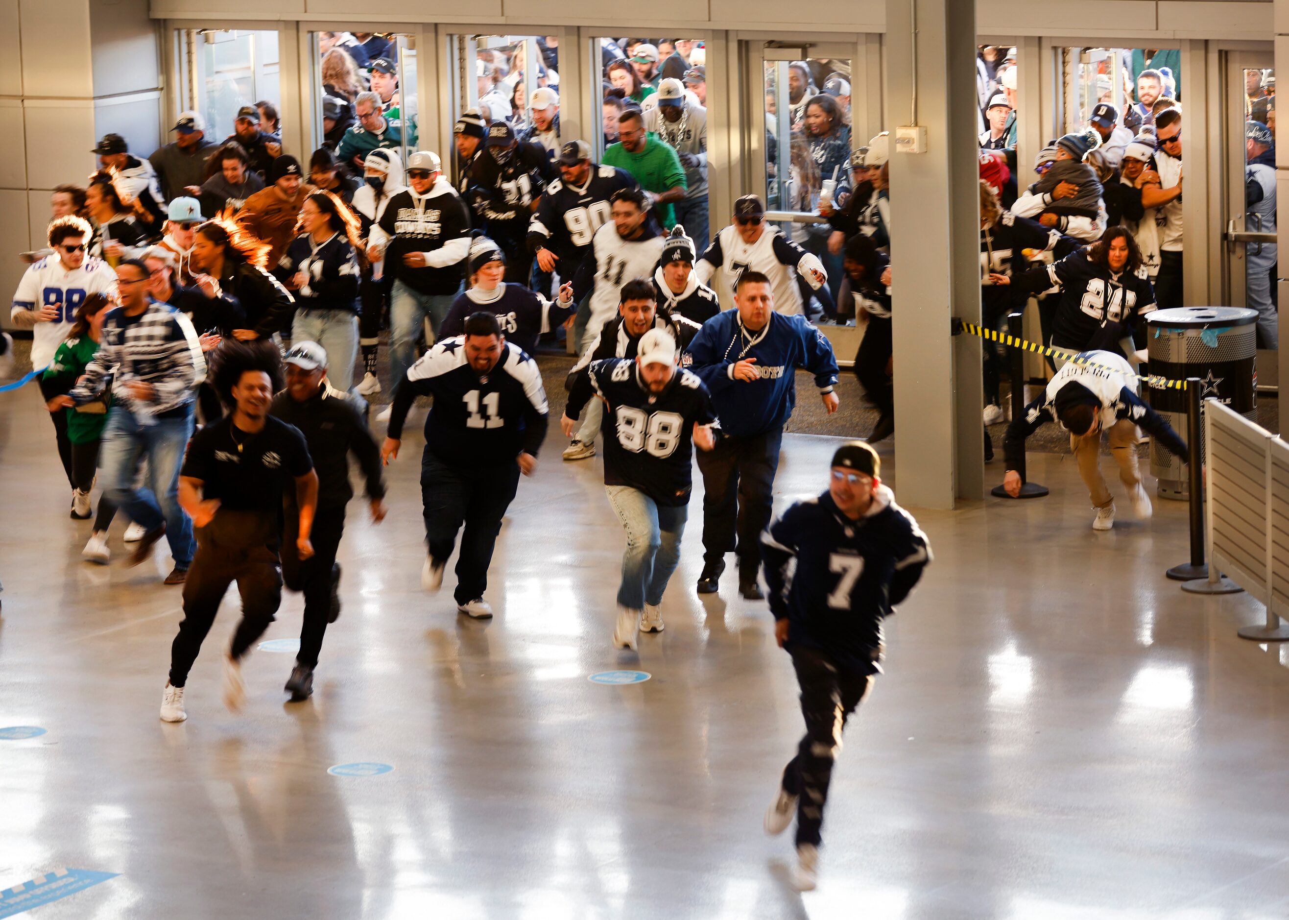 As the doors opened at 5pm, Dallas Cowboys and Philadelphia Eagles fans race to the stairs...