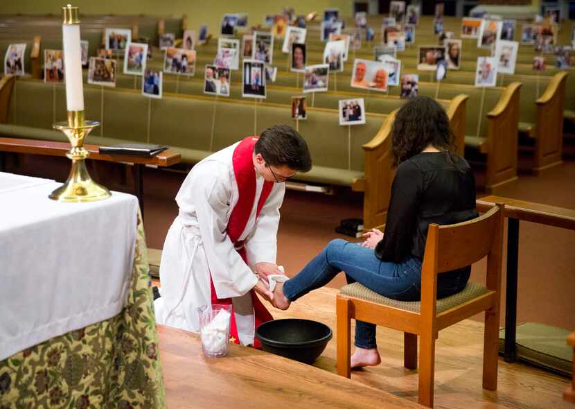 Before a sanctuary full of parishioners photos, Reverend Ryan Jordan, a curate at St. Philip...