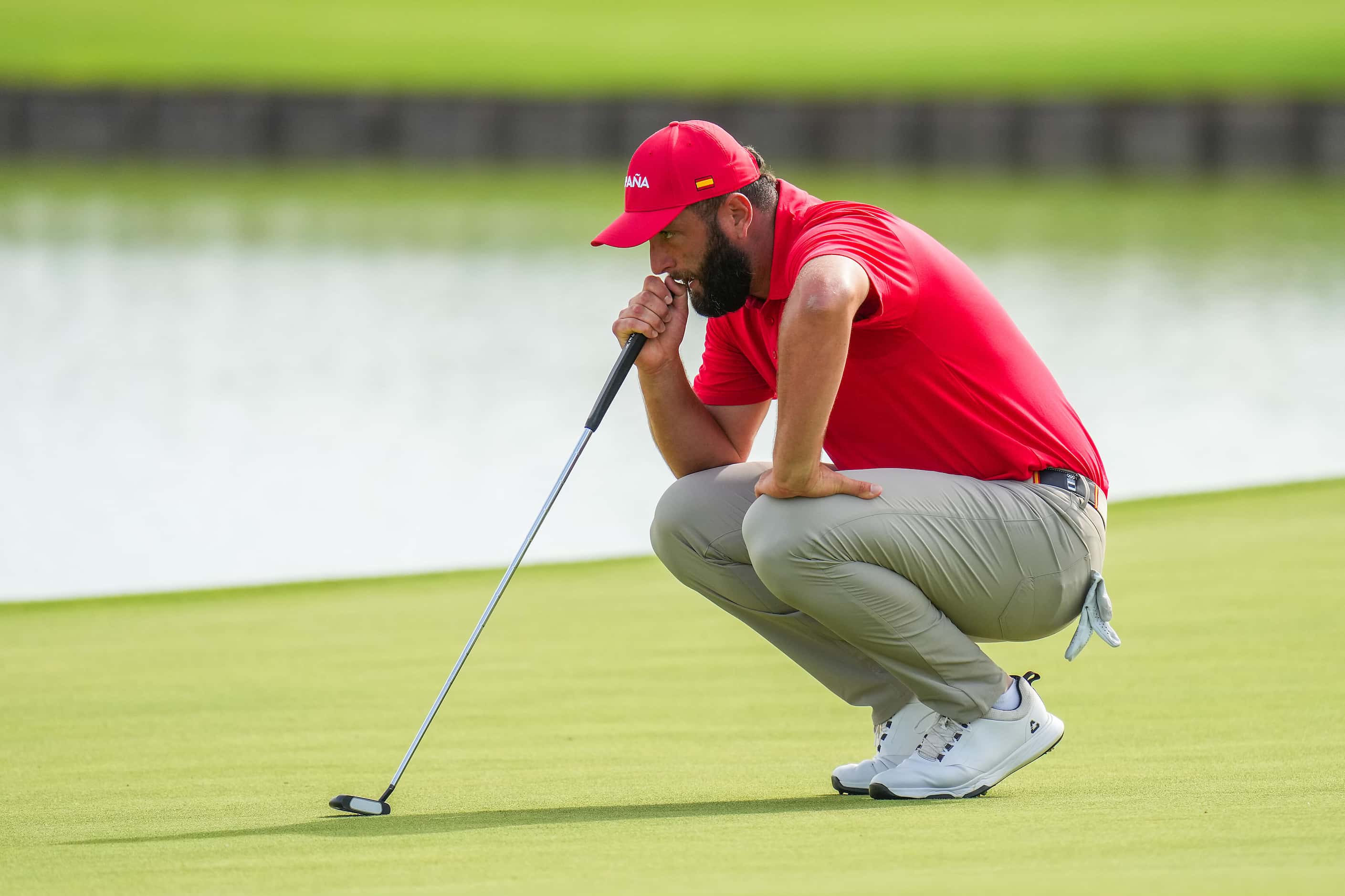 Jon Rahm of Spain lines up a put during the final round of men's golf at the 2024 Summer...