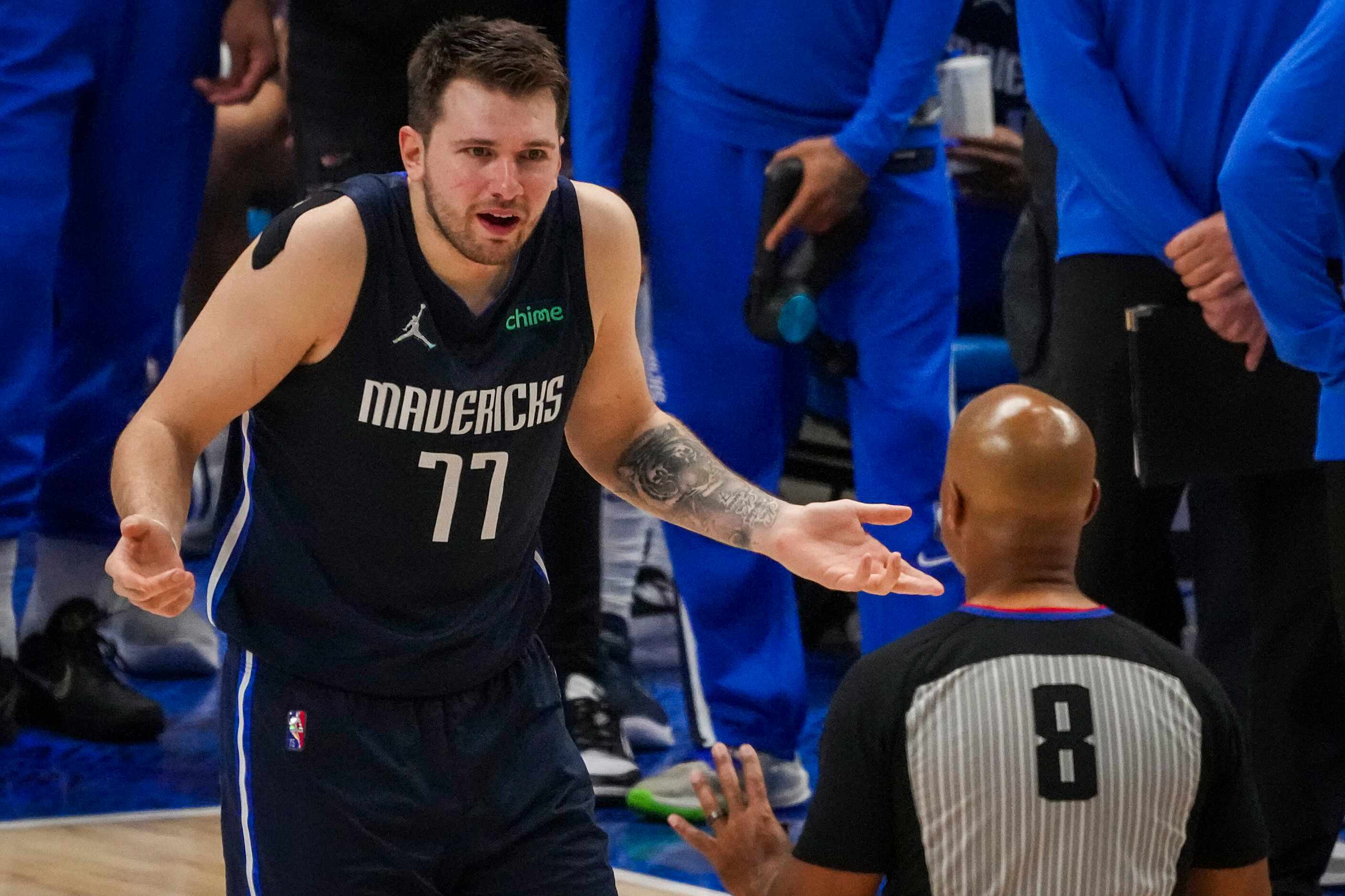 Dallas Mavericks guard Luka Doncic reacts after an offensive foul call against Golden State...