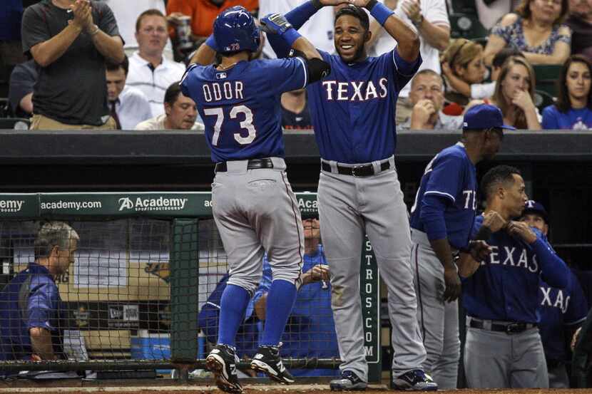 Texas Rangers shortstop Elvis Andrus (1) congratulates second baseman Rougned Odor (73)...