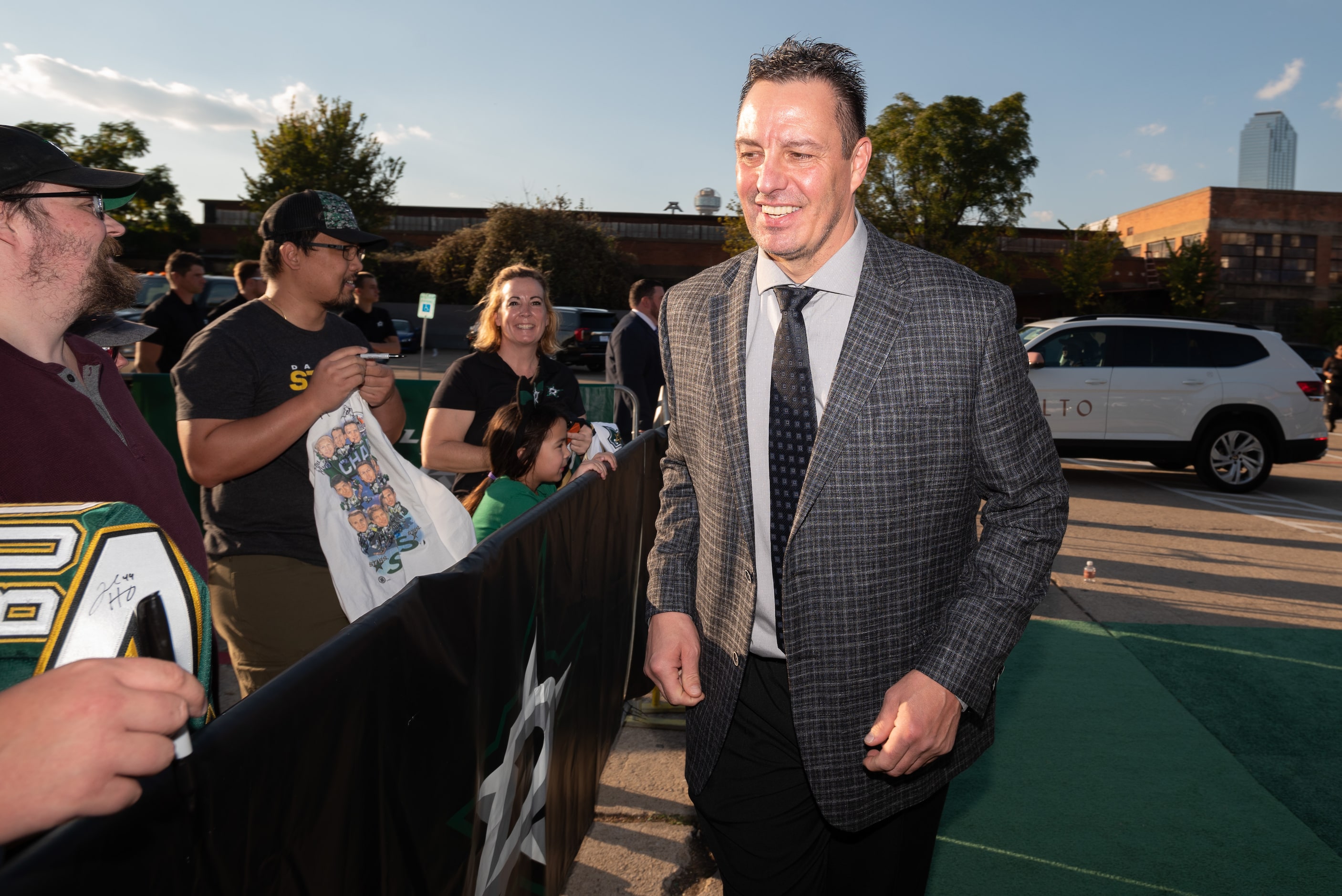 Former Dallas Stars player Richard Matvichuk greets fans as he arrives for the Stars' Hall...