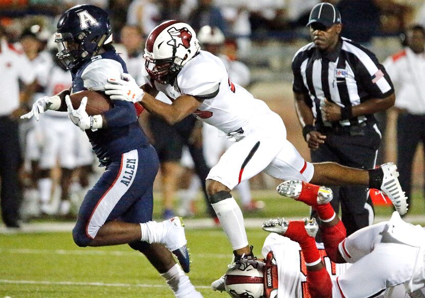 Allen running back Brock Sturges (5) goes throught the line as Cedar Hill linebacker...