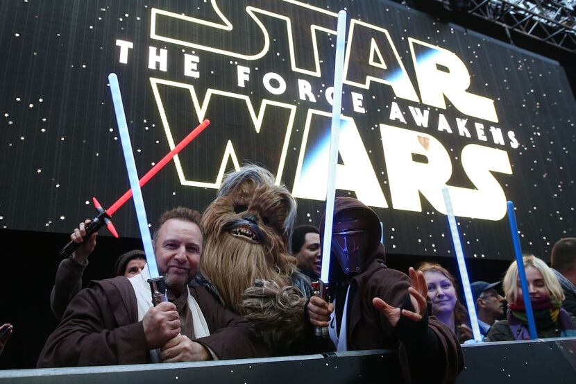 Star Wars fans wait in line for the European premiere of  The Force Awakens in London.