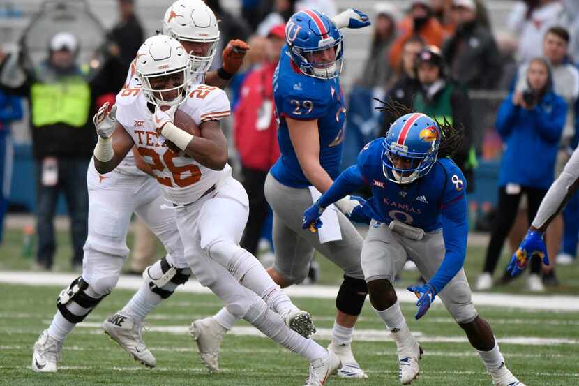 LAWRENCE, KANSAS - NOVEMBER 23: Running back Keaontay Ingram #26 of the Texas Longhorns...