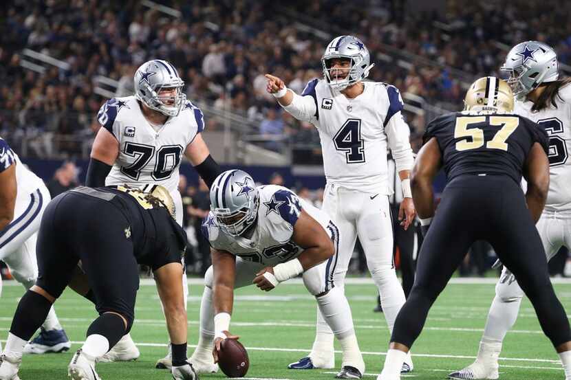 Dallas Cowboys quarterback Dak Prescott (4) calls out a play during the first half of a...