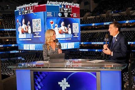 MavsTV talents Dana Larson and Brian Dameris are seen before an NBA basketball game between...