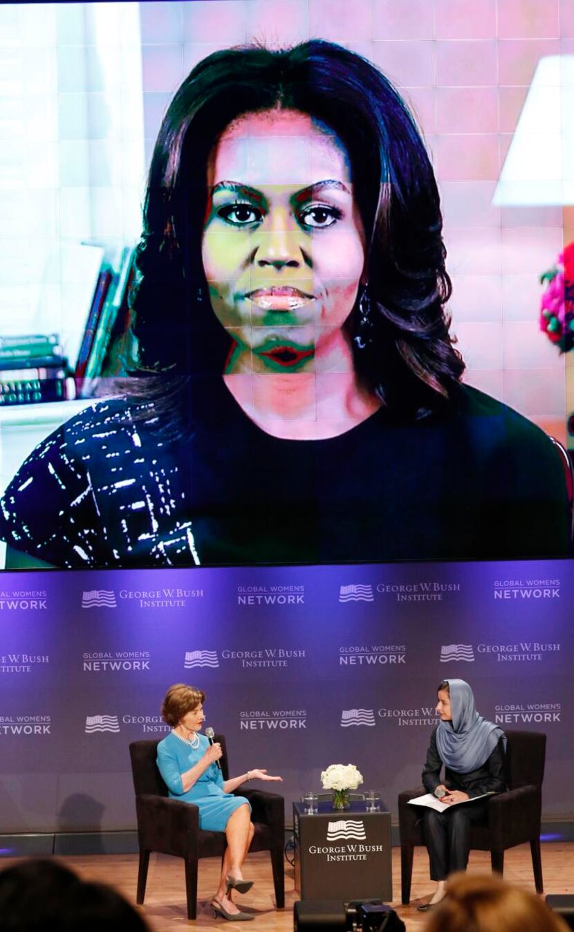 
First lady Michelle Obama joins former first lady Laura Bush and Onaba Payab of Afghanistan...