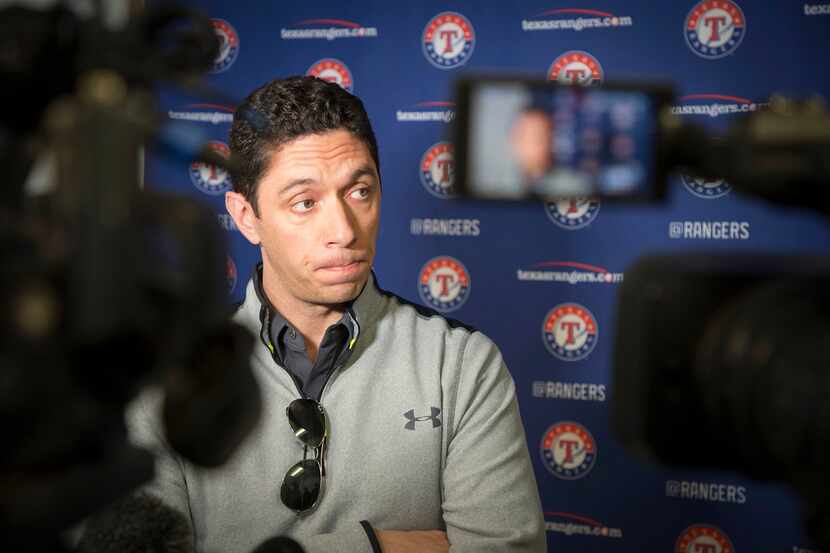 Rangers general manager Jon Daniels fields questions at the team's spring training facility...