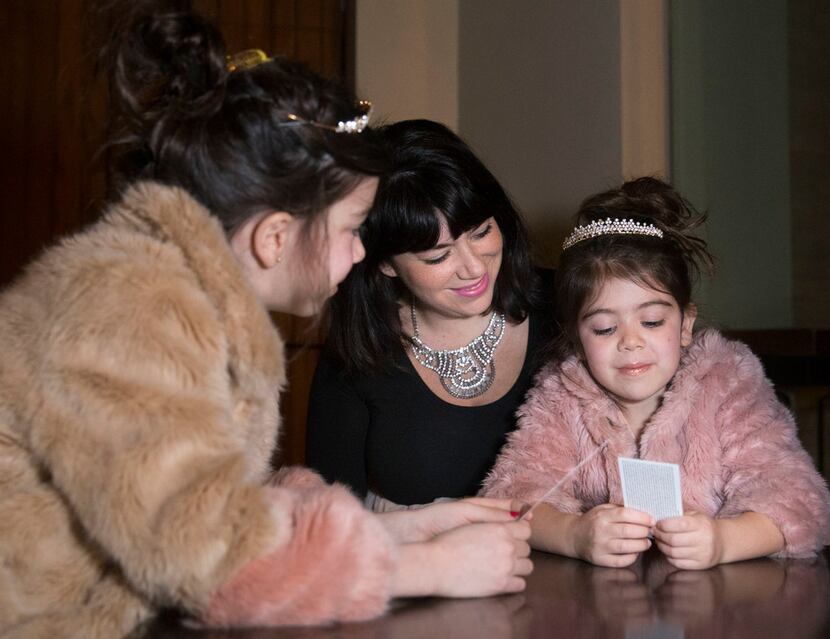 From left, 8-year-old Dotty Rico and her mother, Alicia Rico, talk with Dotty's sister,...