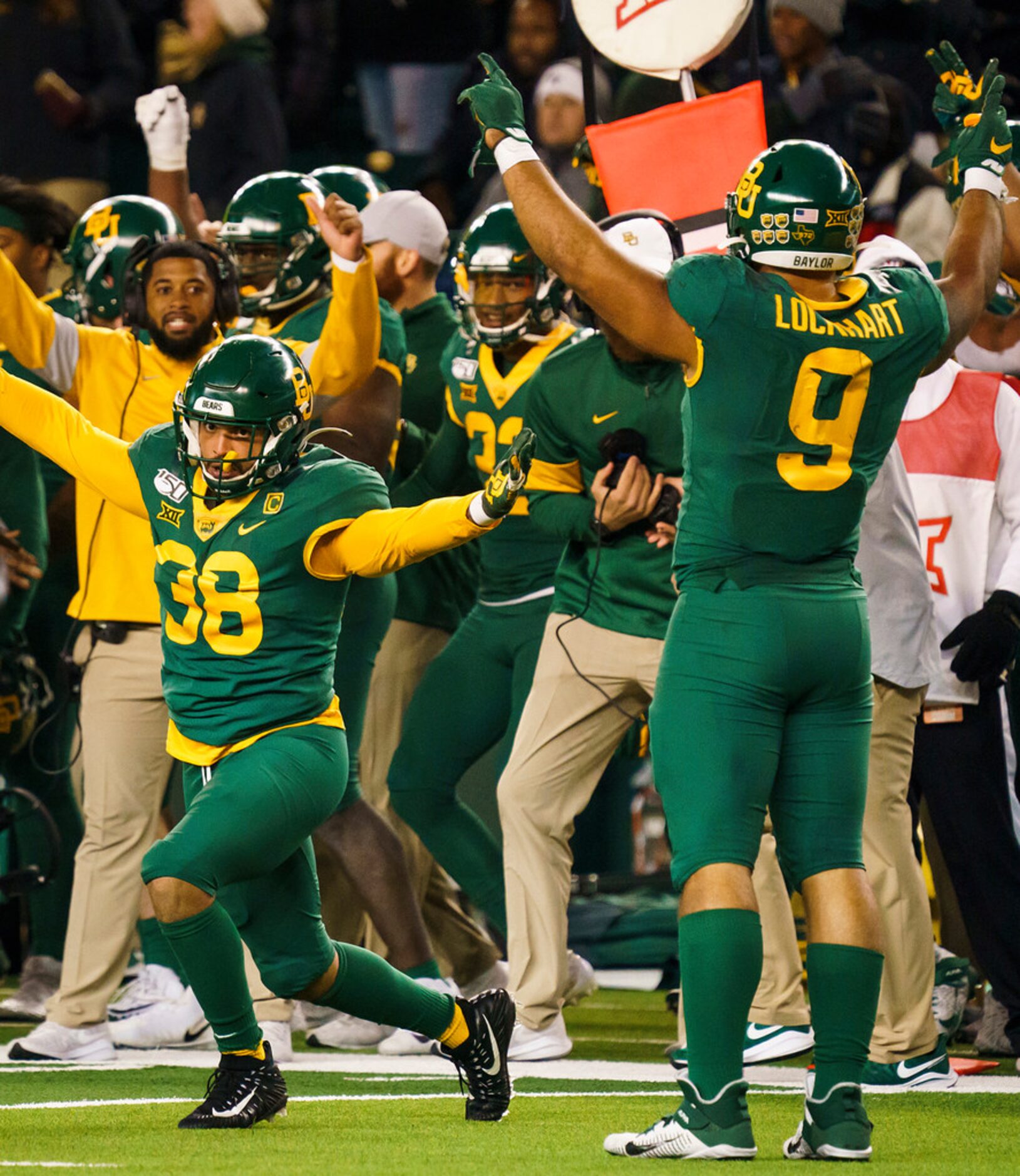 Baylor linebacker Jordan Williams (38) and defensive end James Lockhart (9) celebrate as...