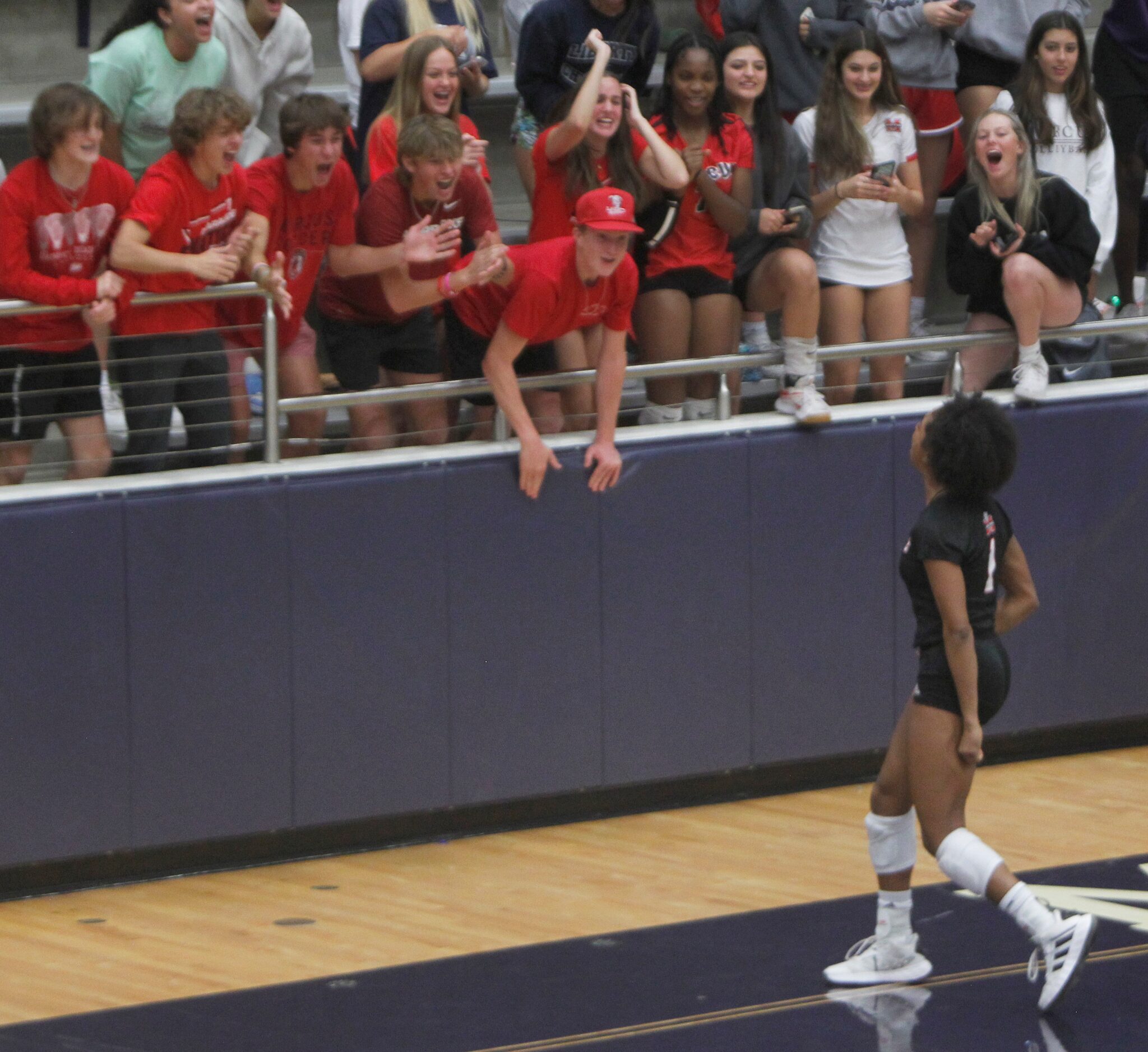 Flower Mound Marcus students react as Marauders player Madison Dyer (1 )acknowledges them...