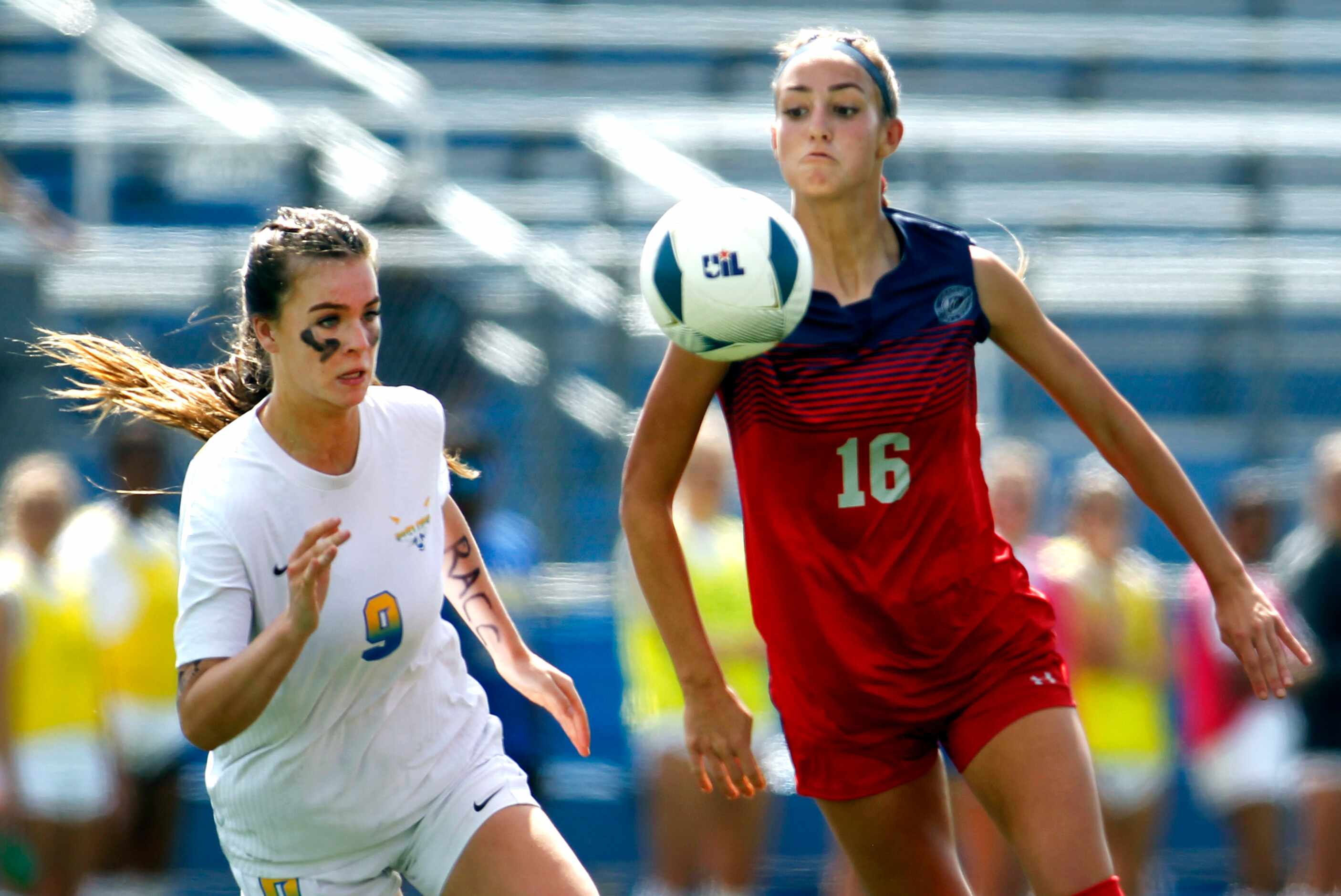 Grapevine midfielder Luciana Delloso (16) eyes the ball as she is challenged by Frisco...
