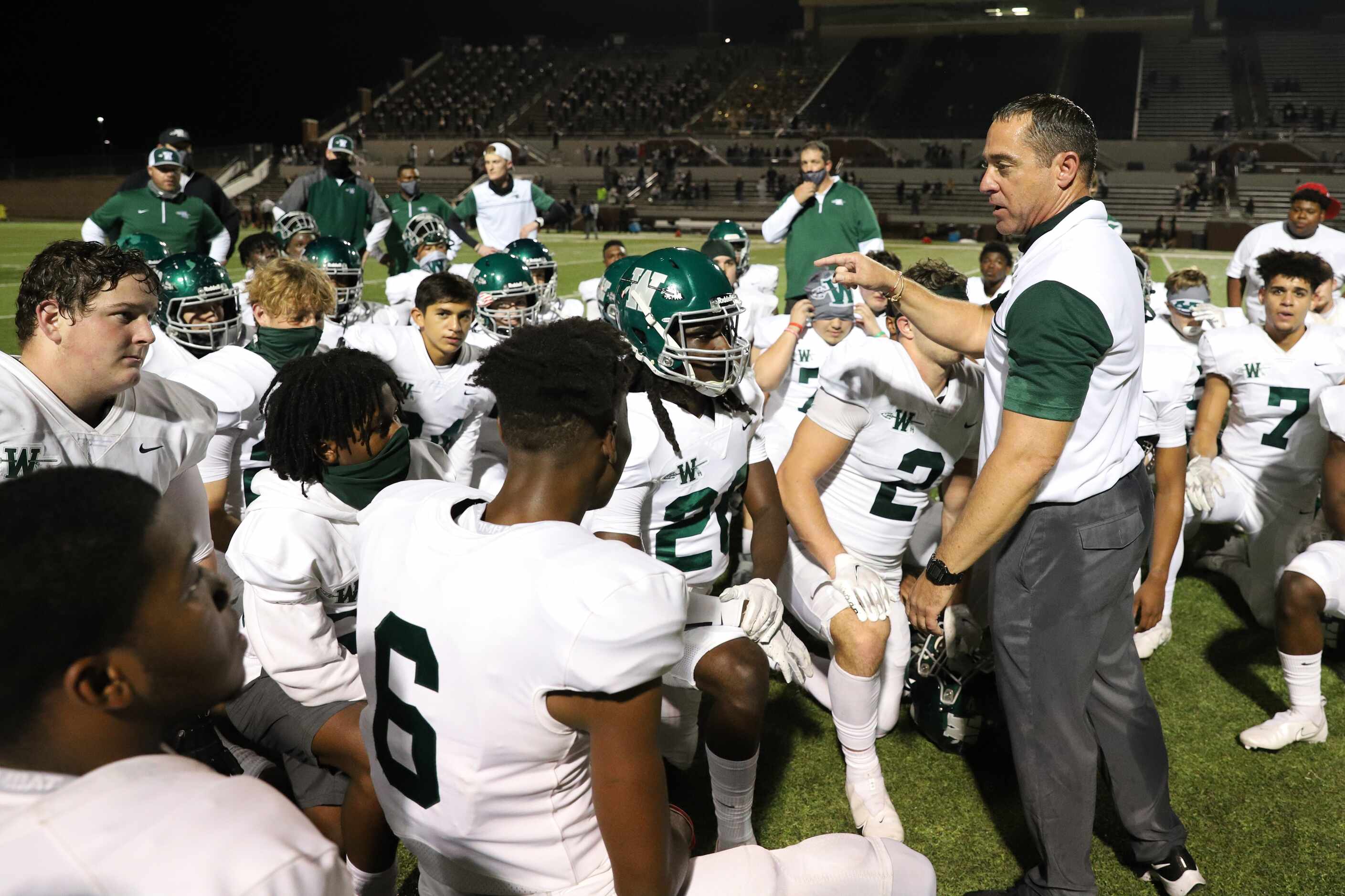 Mansfield head coach Todd Alexander speaks to his team following a win against Mansfield at...