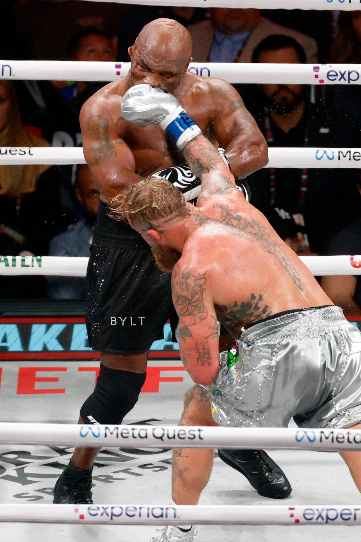 Jake Paul lands a punch on Mike Tyson during round five of a heavyweight boxing match,...