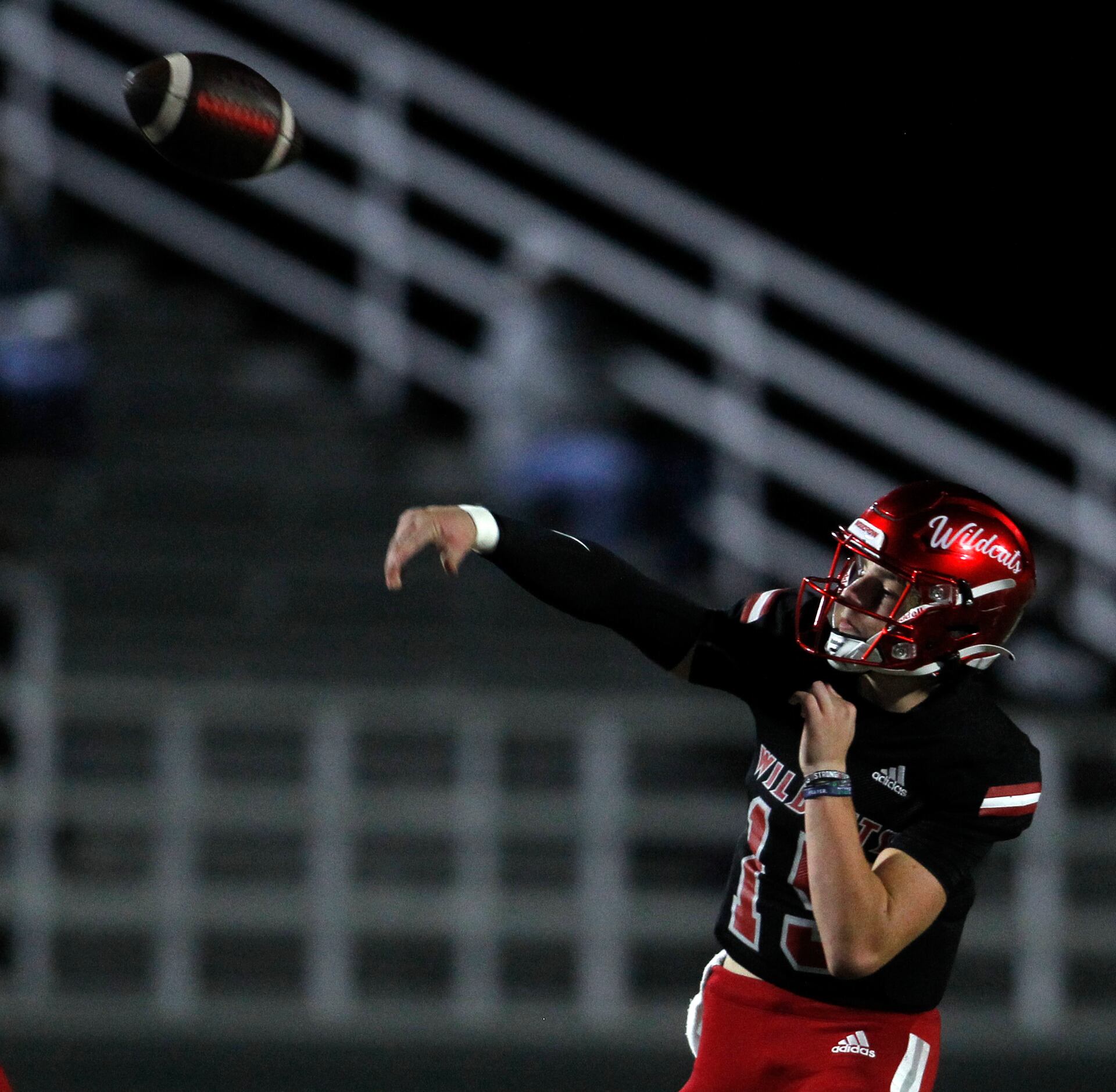 Dallas Woodrow Wilson quarterback Cam McGuire (15) launches a long pass during first quarter...