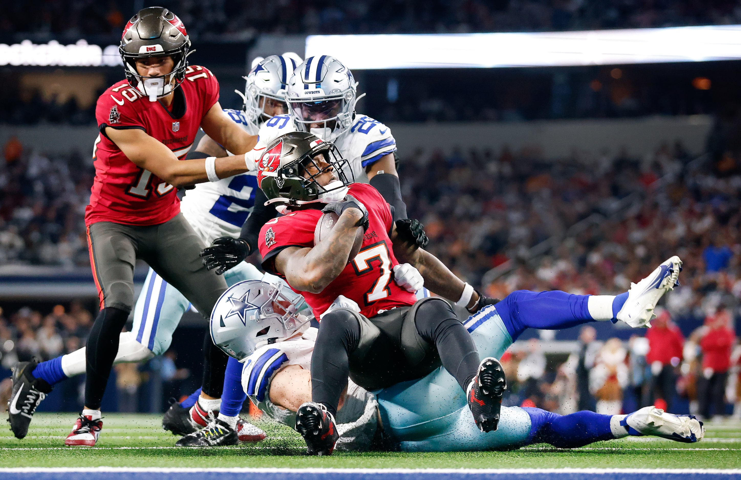 Dallas Cowboys linebacker Nick Vigil (41) brings down Tampa Bay Buccaneers running back...