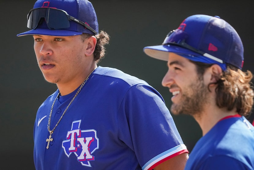 Outfielder Dustin Harris (left) and Infielder Josh Smith wait their turn in the batting cage...