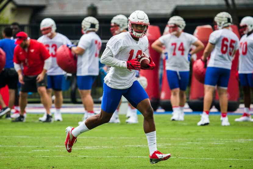 Wide receiver Courtland Sutton (16) runs the ball during SMU's first football practice of...