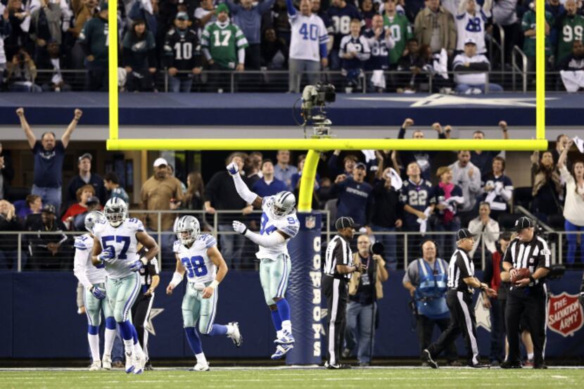 Dallas Cowboys defensive end DeMarcus Ware (94) celebrates after the defense stopped the...