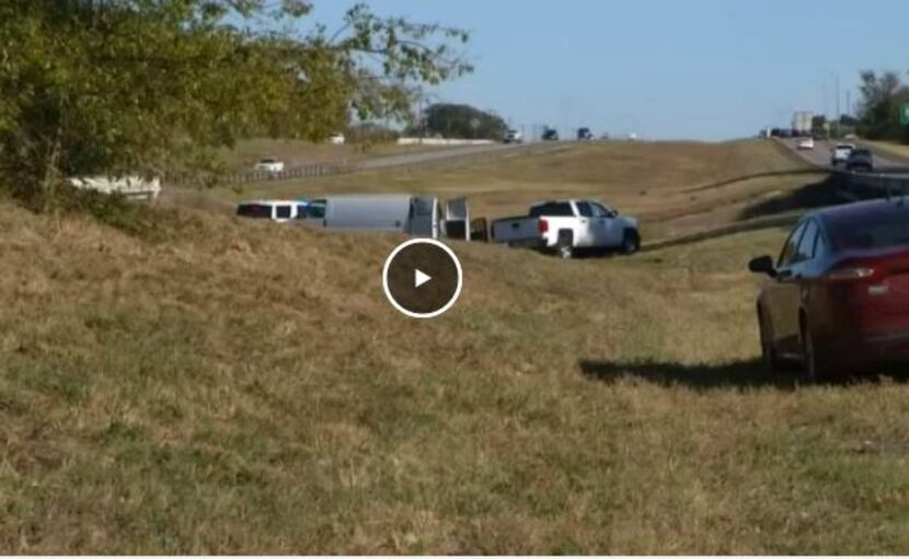 Police process the scene where Freddie Gilbert ran off the road following a police chase in...