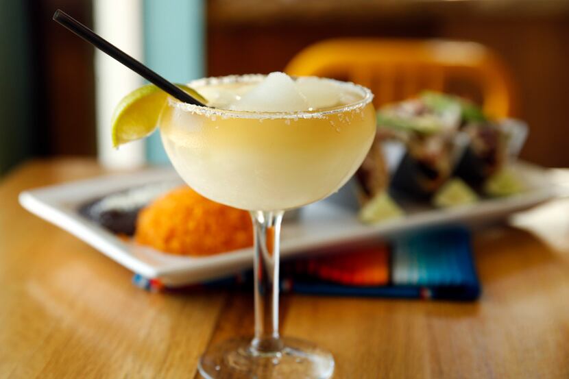 The frozen house margarita is served with fish tacos at El Rincon Mexican Restaurant &...
