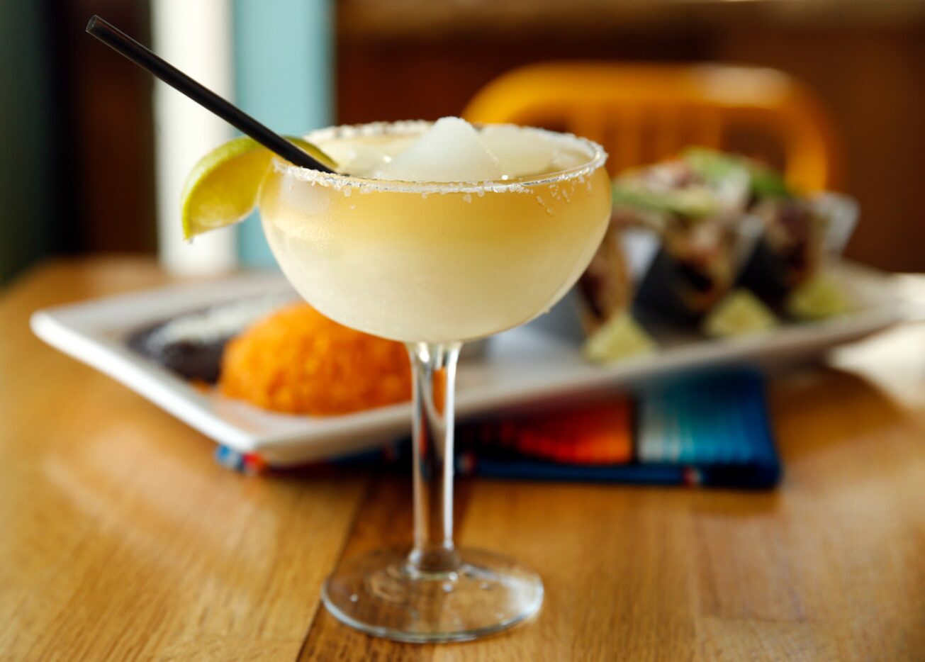 The frozen house margarita is served with fish tacos at El Rincon Mexican Restaurant &...