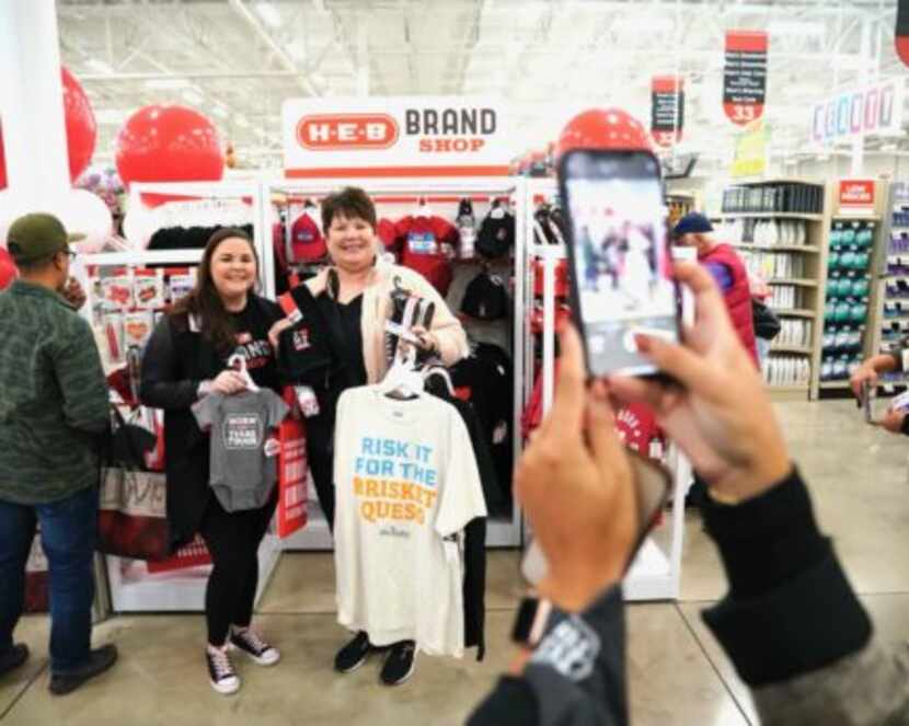 Customers in Kerrville select items from the first H-E-B brand shop. Two more opened this...