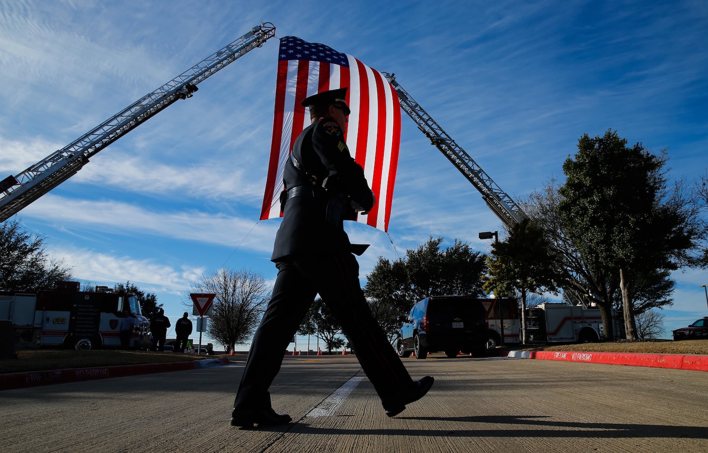 Lewisville Honor Guard Sgt. Ken Naffziger arrives for the funeral service of Little Elm...