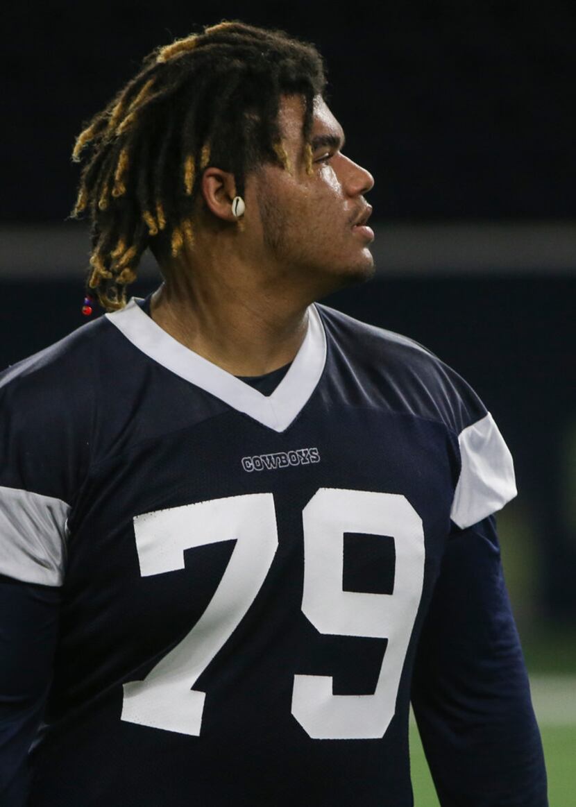 Dallas Cowboys defensive tackle Trysten Hill participates in a drill during a Cowboys...