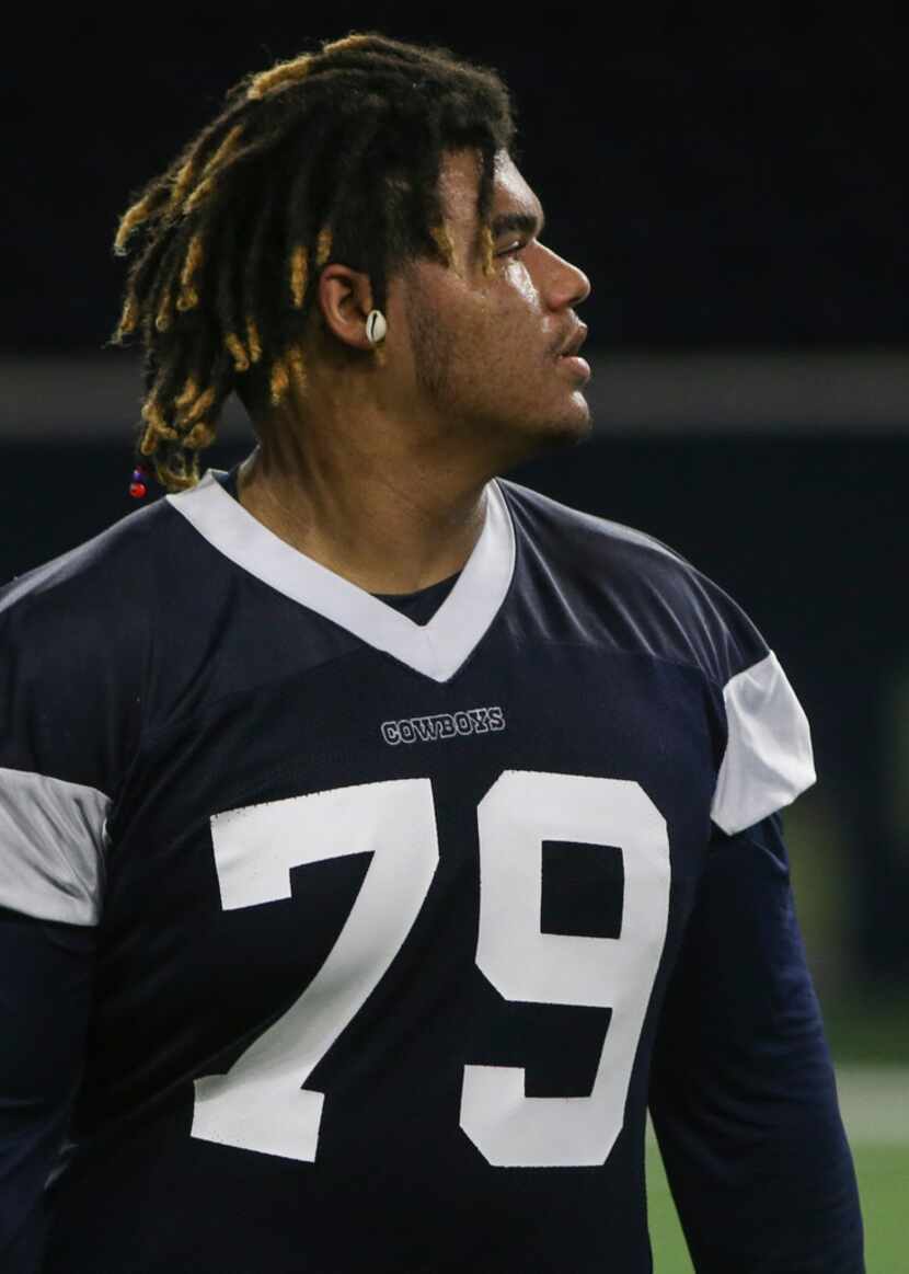 Dallas Cowboys defensive tackle Trysten Hill participates in a drill during a Cowboys...