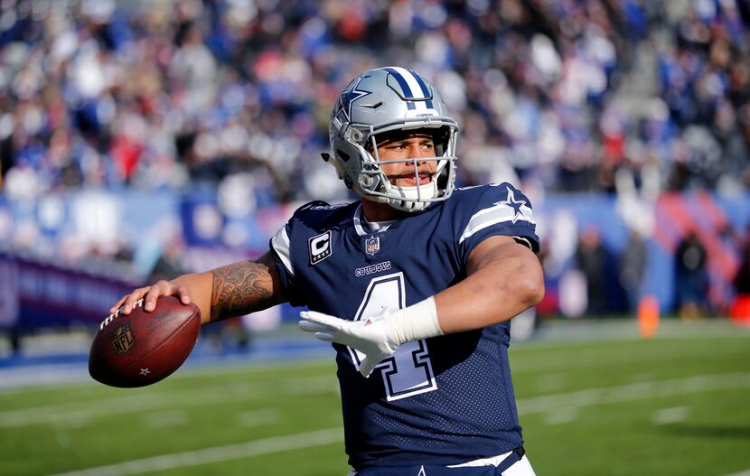 Dallas Cowboys quarterback Dak Prescott (4) warms up on the sideline before facing the New...