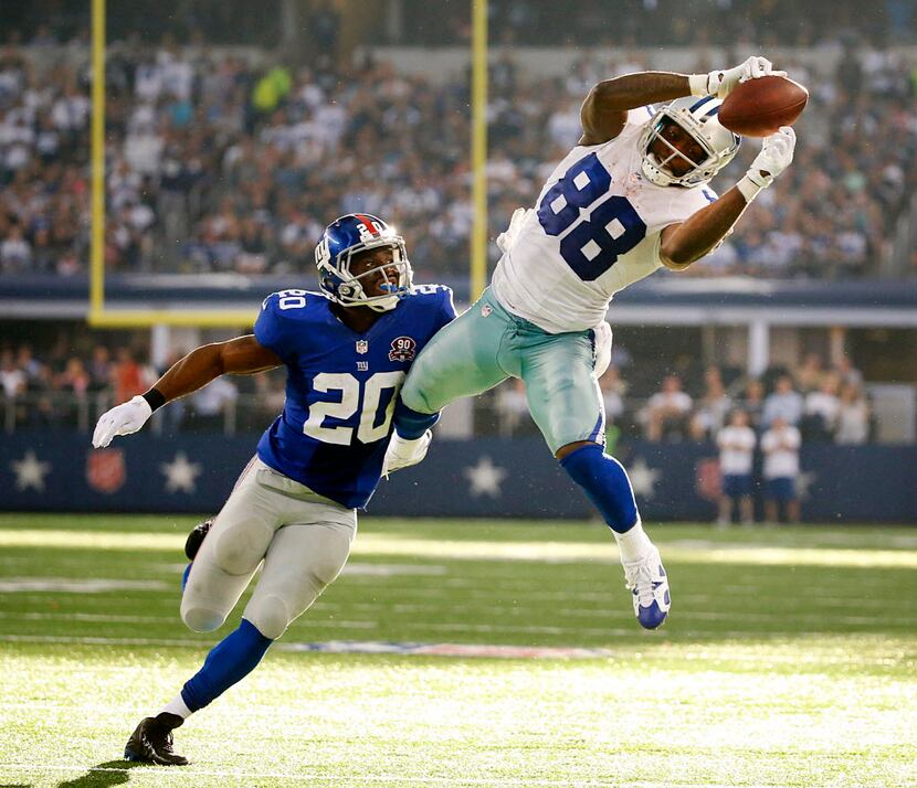 Dallas Cowboys wide receiver Dez Bryant (88) leaps high over New York Giants cornerback...