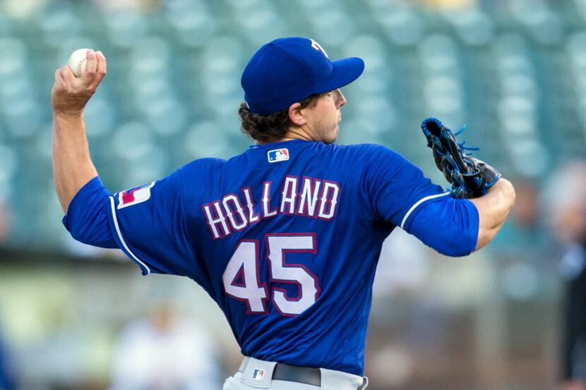 May 16, 2016; Oakland, CA, USA;  Texas Rangers starting pitcher Derek Holland (45) throws...