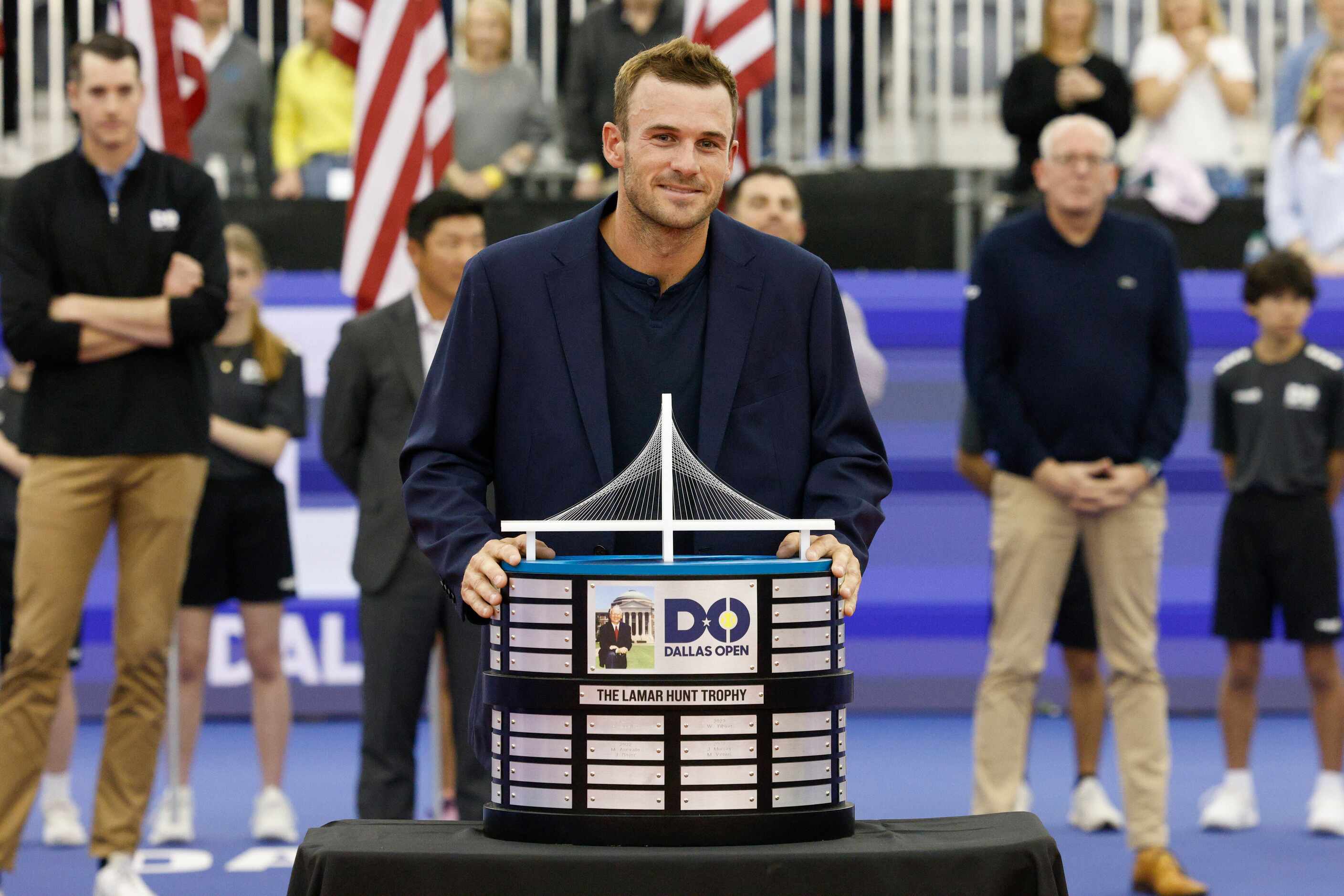 Tommy Paul of the U.S. poses with the Lamar Hunt Trophy after winning the ATP Dallas Open...