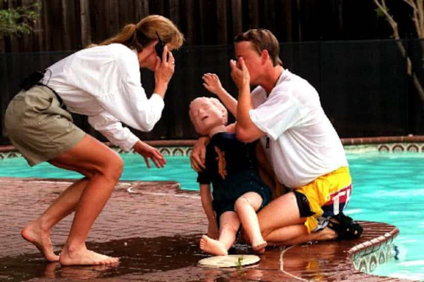 In this 1999 demonstration, Children's Medical Center nurse Kim Yeakel and respiratory...