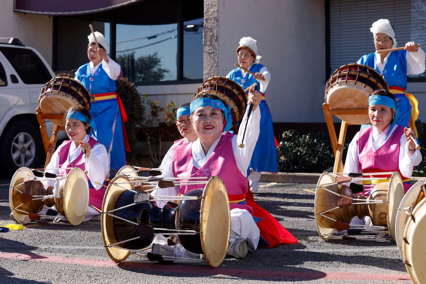 Members of the Korean Senior Citizen Association of Dallas perform during a ceremony to...