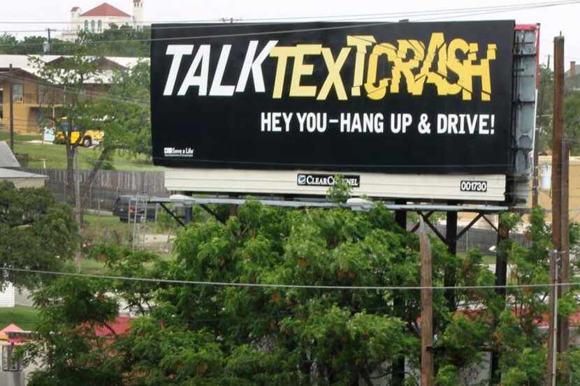 
A billboard warns of the danger of texting and driving on Interstate 35E in Dallas....