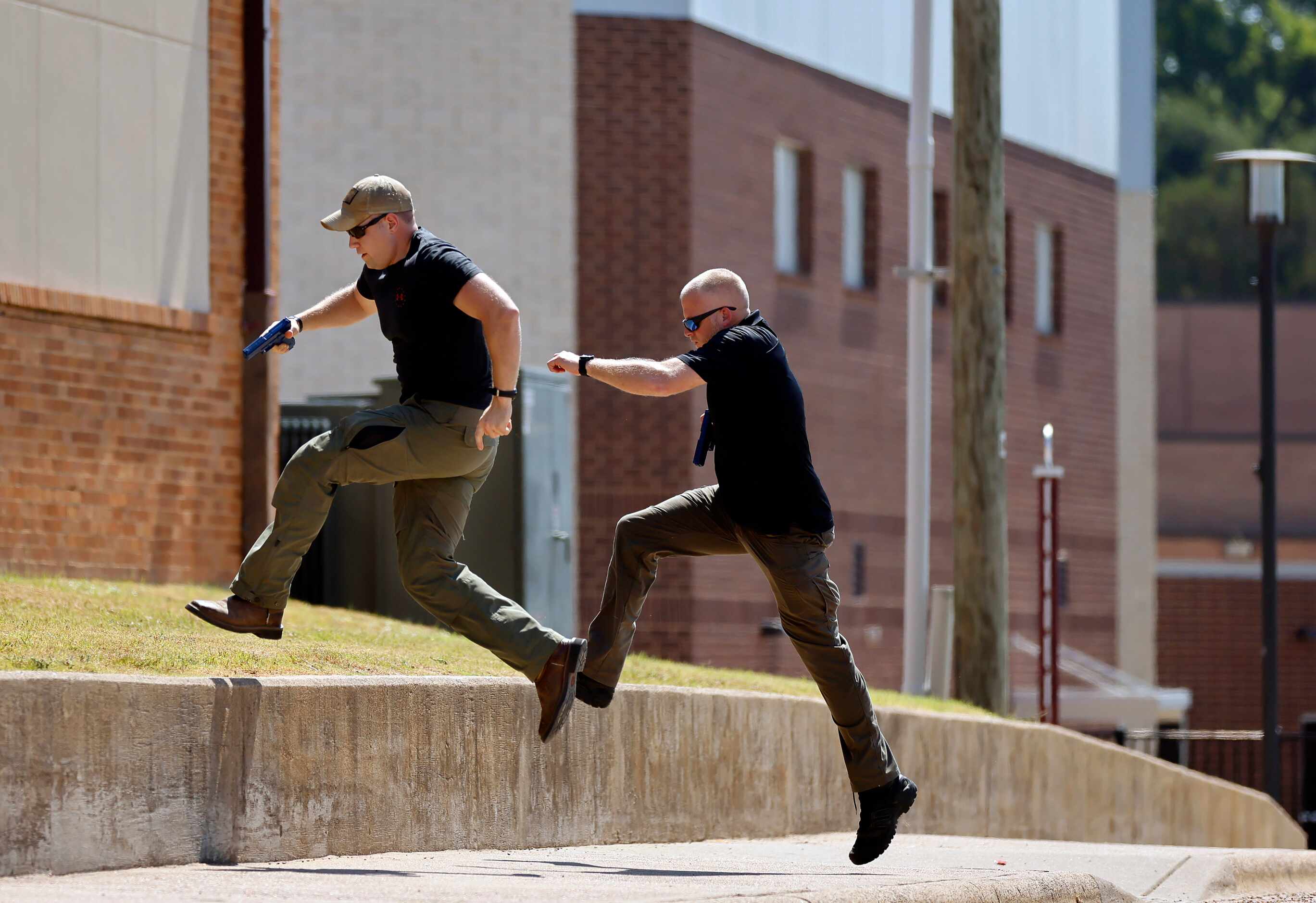 During a training session, Athens Police Officers Zachary Harris (left) and Adam Parkins...