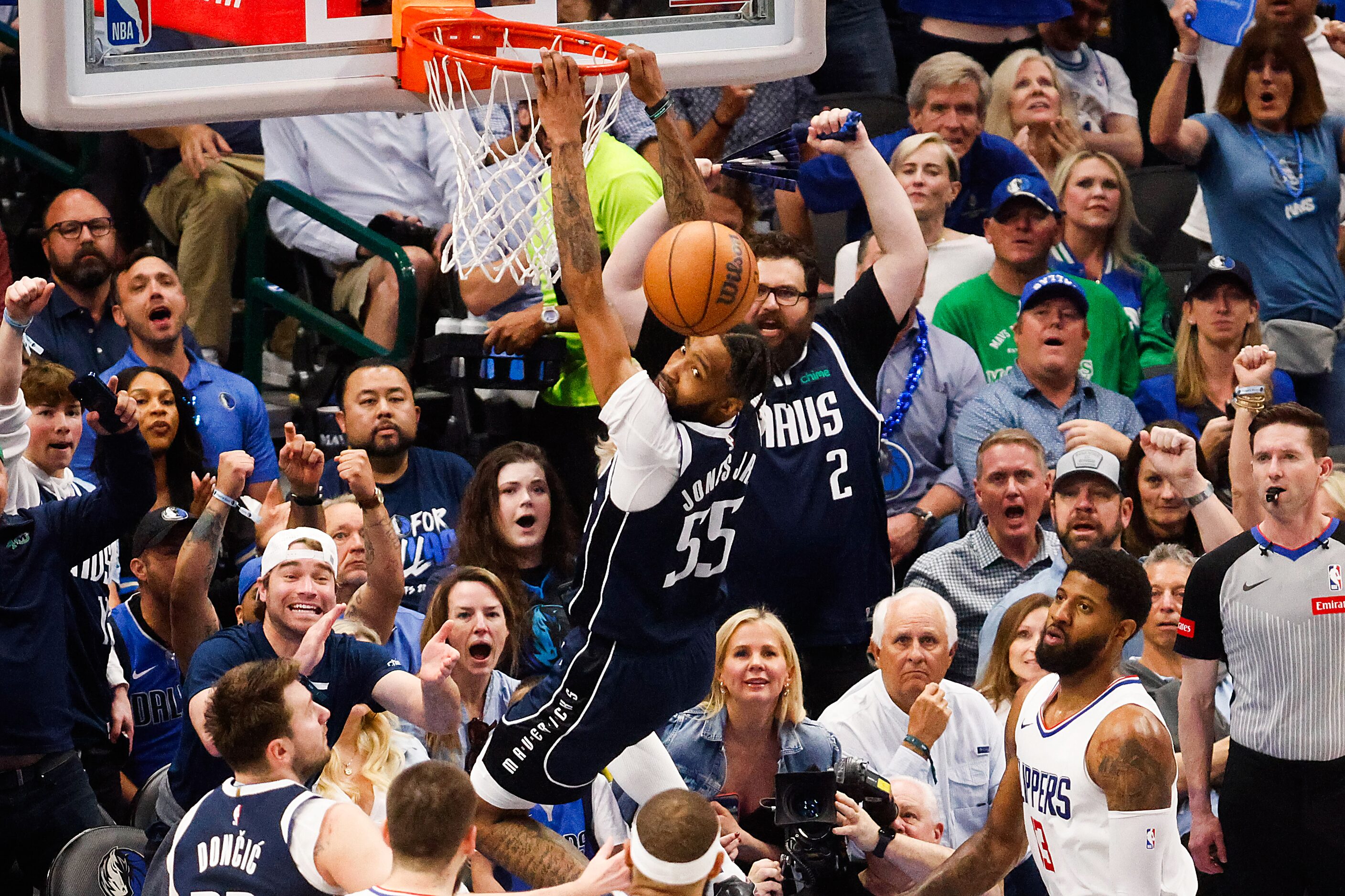 Dallas Mavericks forward Derrick Jones Jr. (55) watches the ball deflect after he misses to...