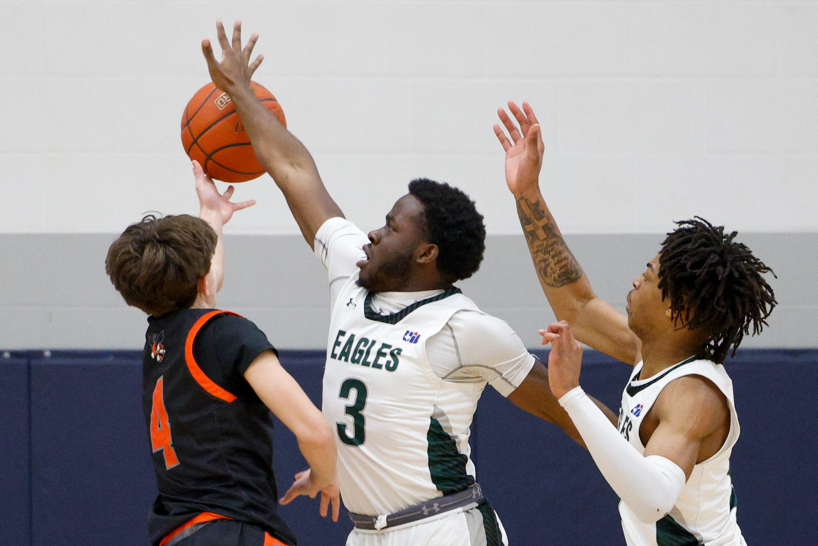 Mansfield Lake Ridge's Ehi Akharoh (3) blocks a shot attempt from Rockwall's Noah Santoro...