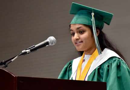 Valedictorian Sherin Grace George speaks during the Mesquite Poteet High School commencement...