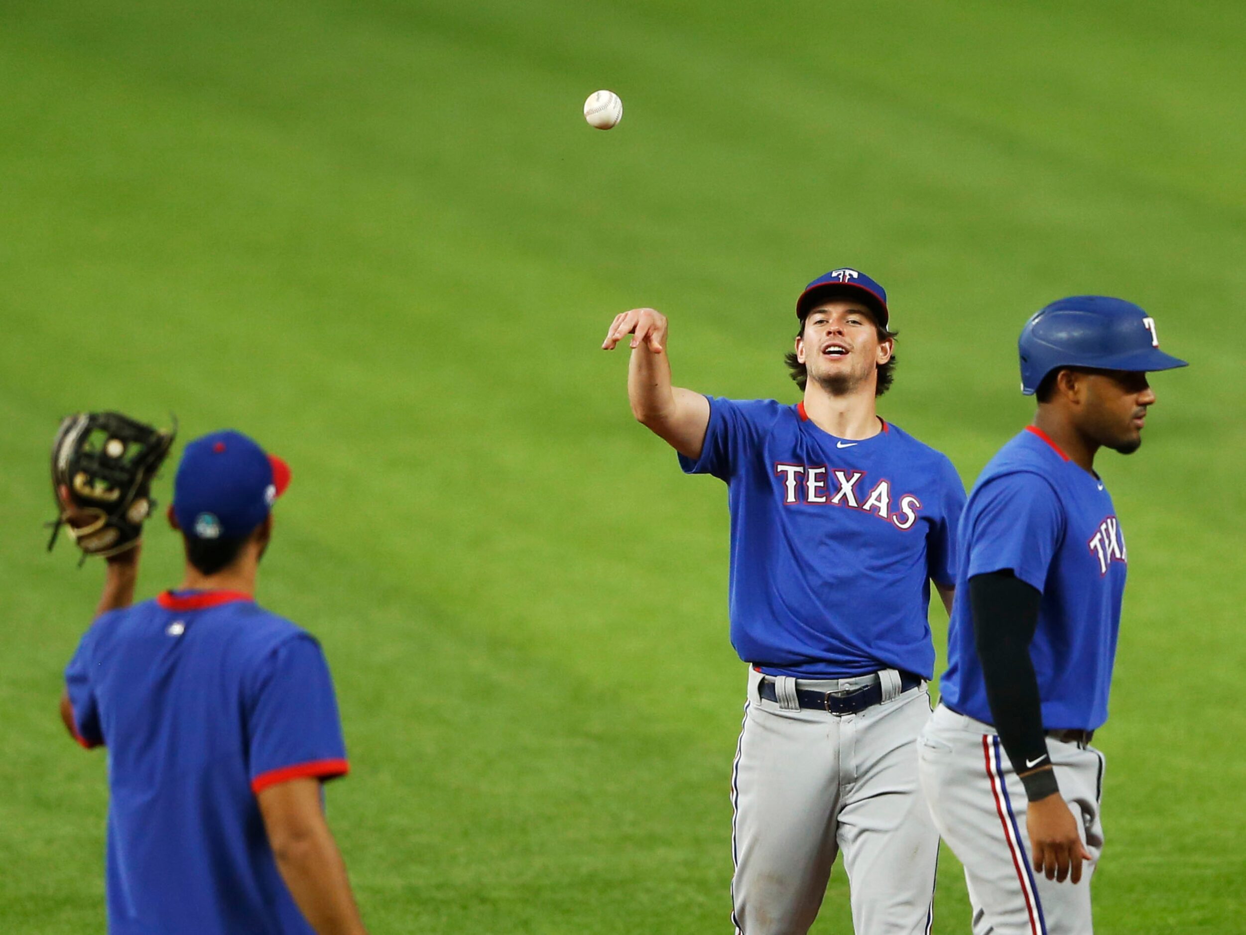 Texas Rangers Nick Solak (15) tosses the ball during Texas Rangers 2020 Summer Camp at Globe...