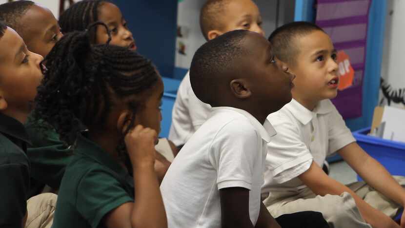 Students react to their teacher's instructions in a classroom at Harllee Early Childhood...