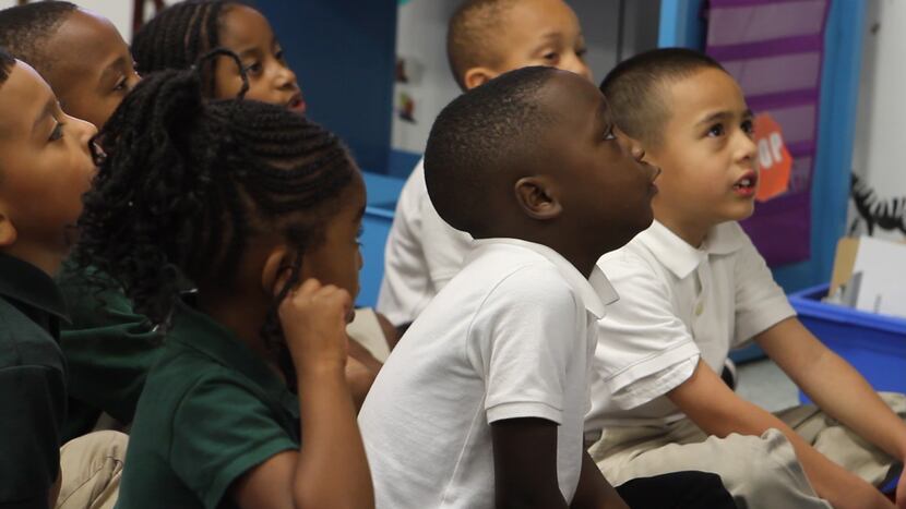 Students react to their teacher's instructions in a classroom at Harllee Early Childhood...