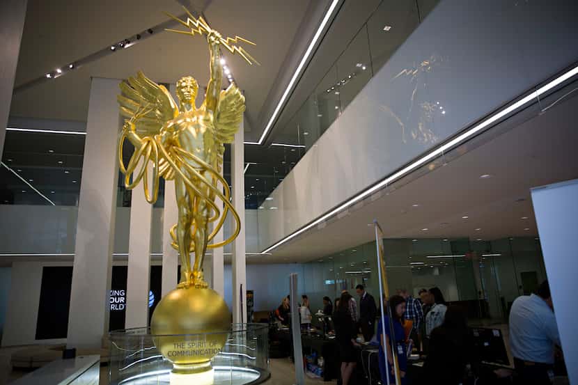 The Spirit of Communications statue is seen in the lobby of AT&T's downtown headquarters...