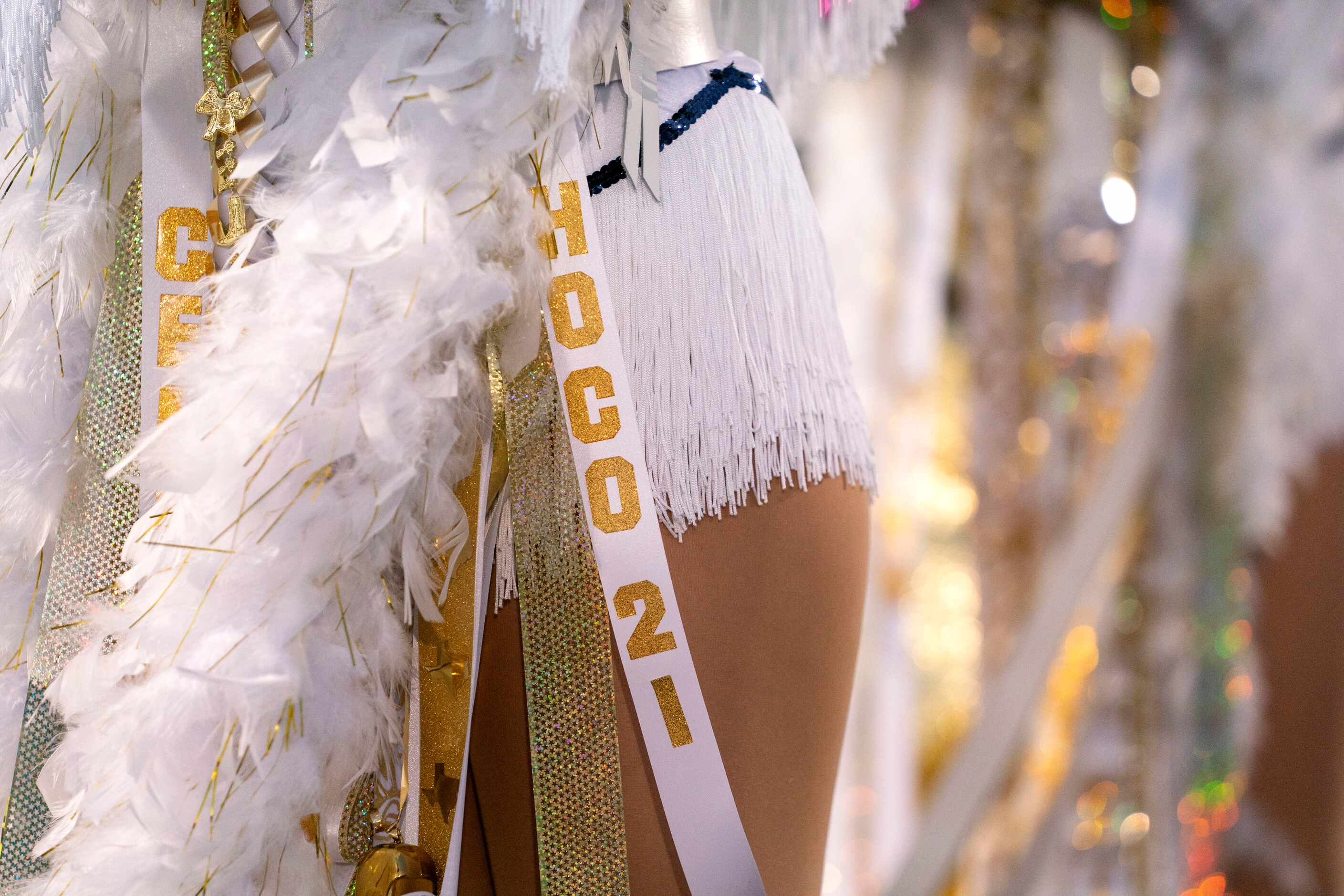 A homecoming ribbon hangs off the mum of one of the Jesuit Rangerettes before a high school...