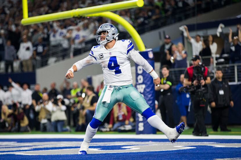 Dallas Cowboys quarterback Dak Prescott (4) celebrates what he thought was a touchdown...